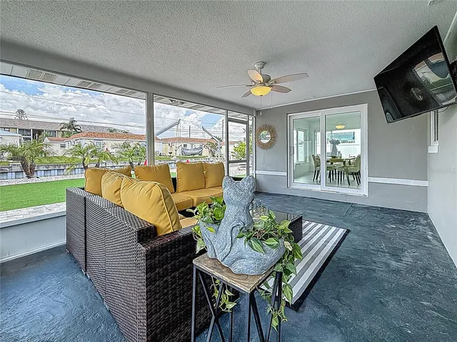an aerial view of a house with a garden and lake view