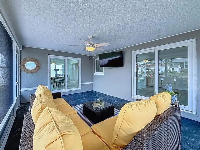 a aerial view of a house with a garden and lake view