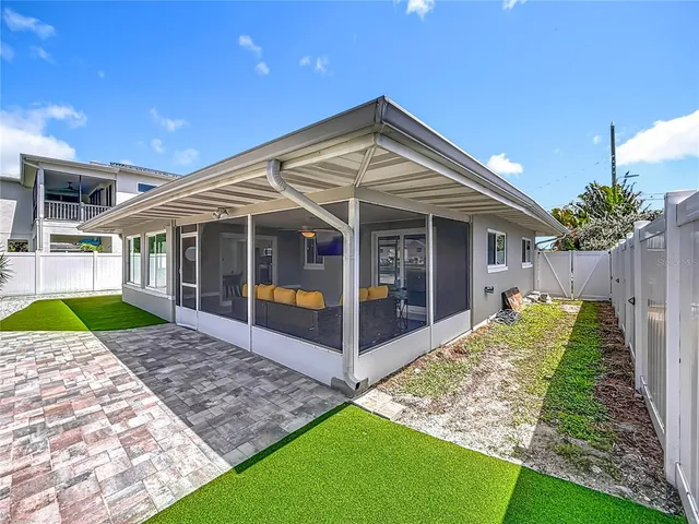 an aerial view of residential houses with swimming pool and outdoor space