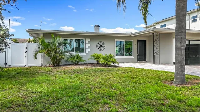 a living room with furniture a dining table and a window