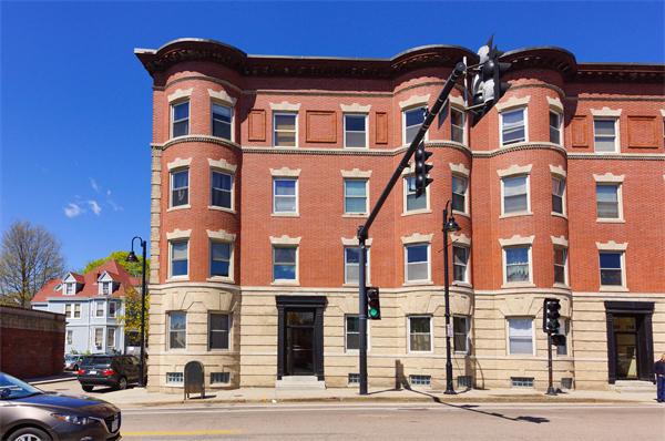 a front view of a building with a street