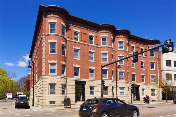 152 Harvard Street, Unit 2 Brookline, MA 02446 - Photo 11 of 11 a front view of a building with lot of cars and trees