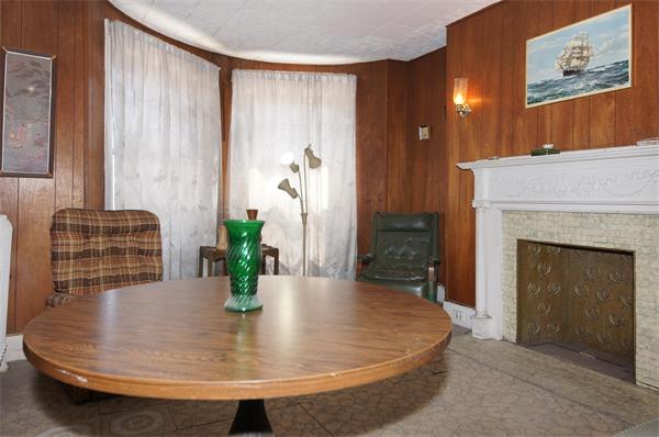 152 Harvard Street, Unit 2 Brookline, MA 02446 - Photo 2 of 11 a living room with furniture and a fireplace