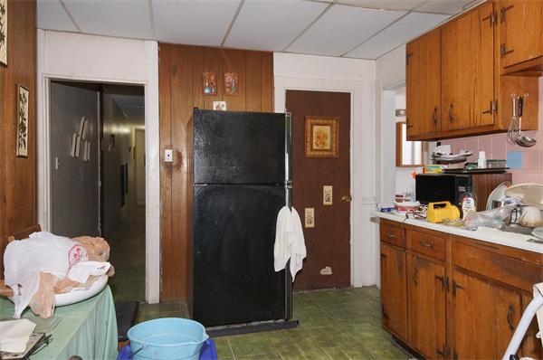152 Harvard Street, Unit 2 Brookline, MA 02446 - Photo 5 of 11 a kitchen with a refrigerator and cabinets