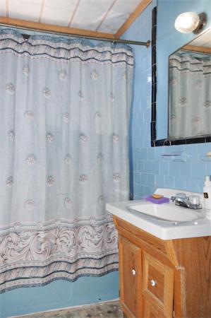 152 Harvard Street, Unit 2 Brookline, MA 02446 - Photo 8 of 11 a bathroom with a sink and a mirror