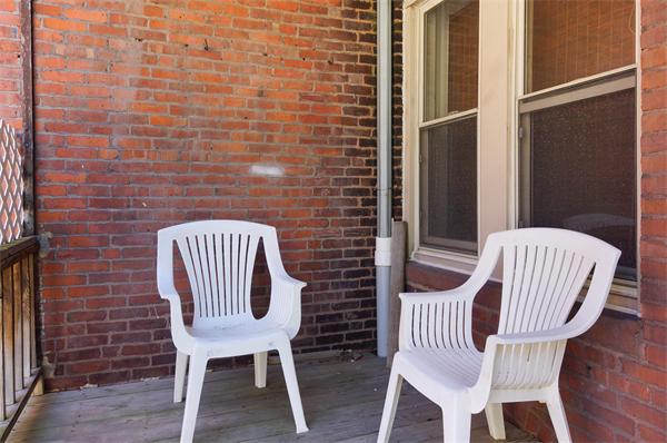 152 Harvard Street, Unit 2 Brookline, MA 02446 - Photo 9 of 11 a view of a chair in the balcony