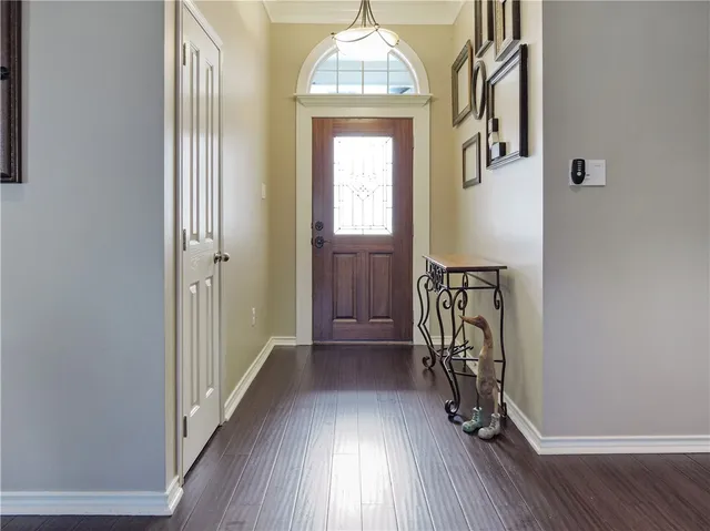 a view of entryway with wooden floor