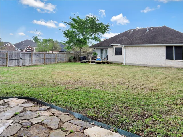 a house view with a garden space