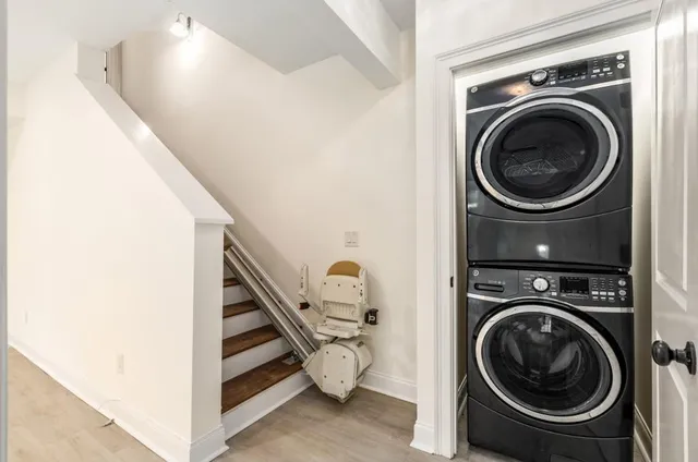 a view of a hallway with washer and dryer