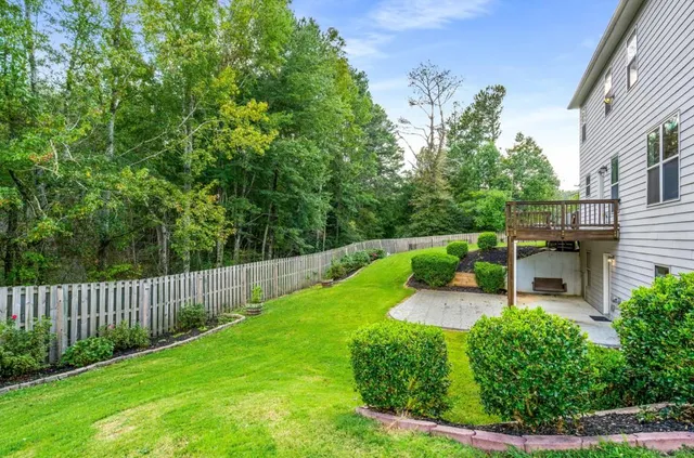 a view of a chair and table in the garden