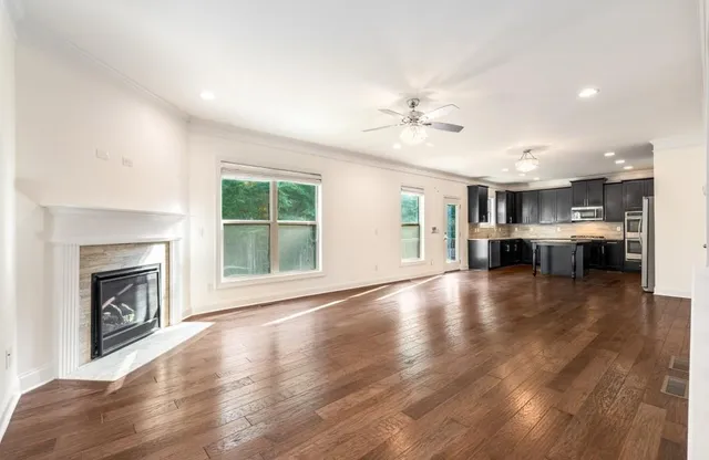 a view of a livingroom with furniture a fireplace