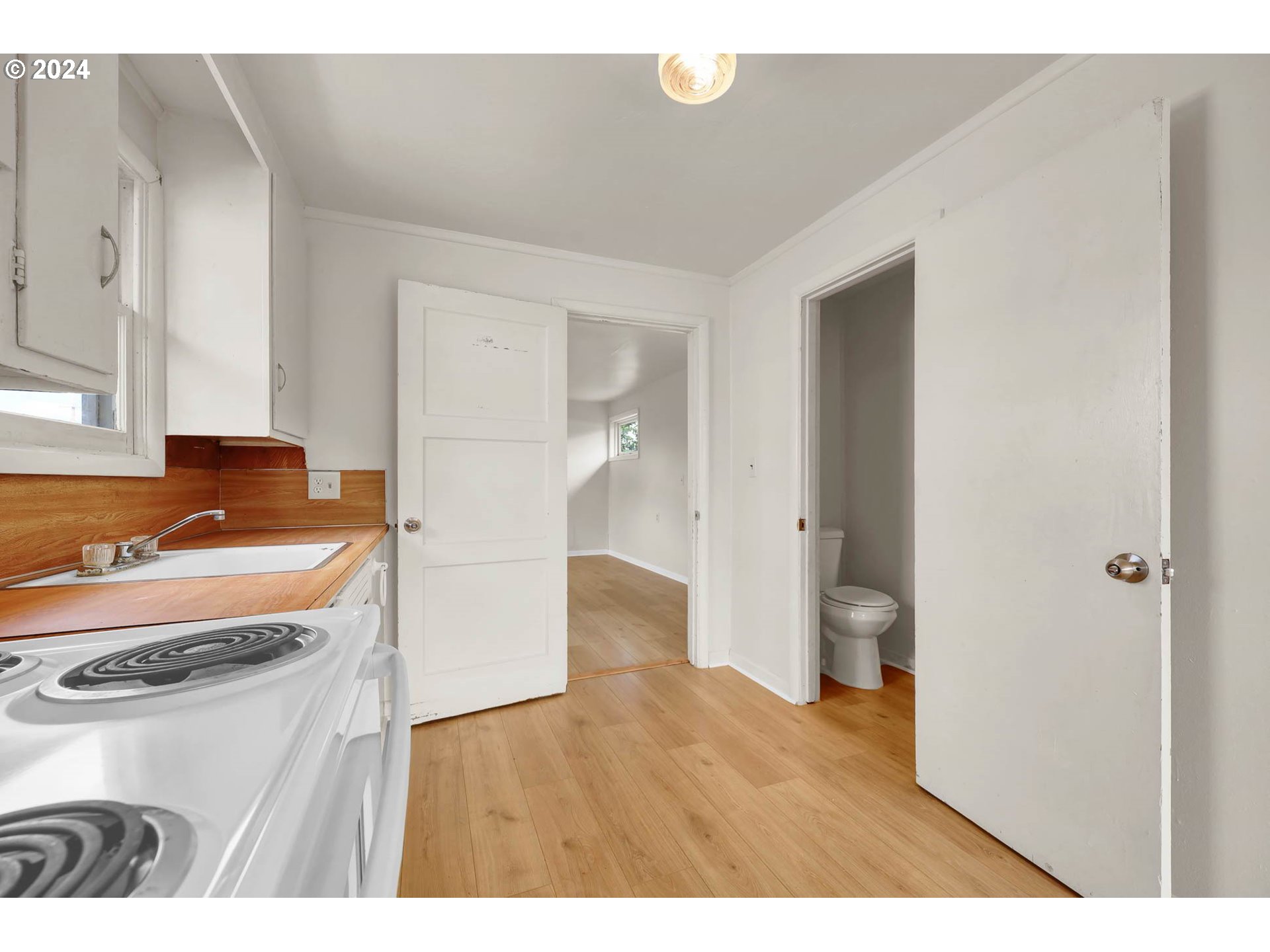2915-2925 Oak Street Eugene, OR 97405 - Photo 17 of 42 a kitchen with a refrigerator and a stove