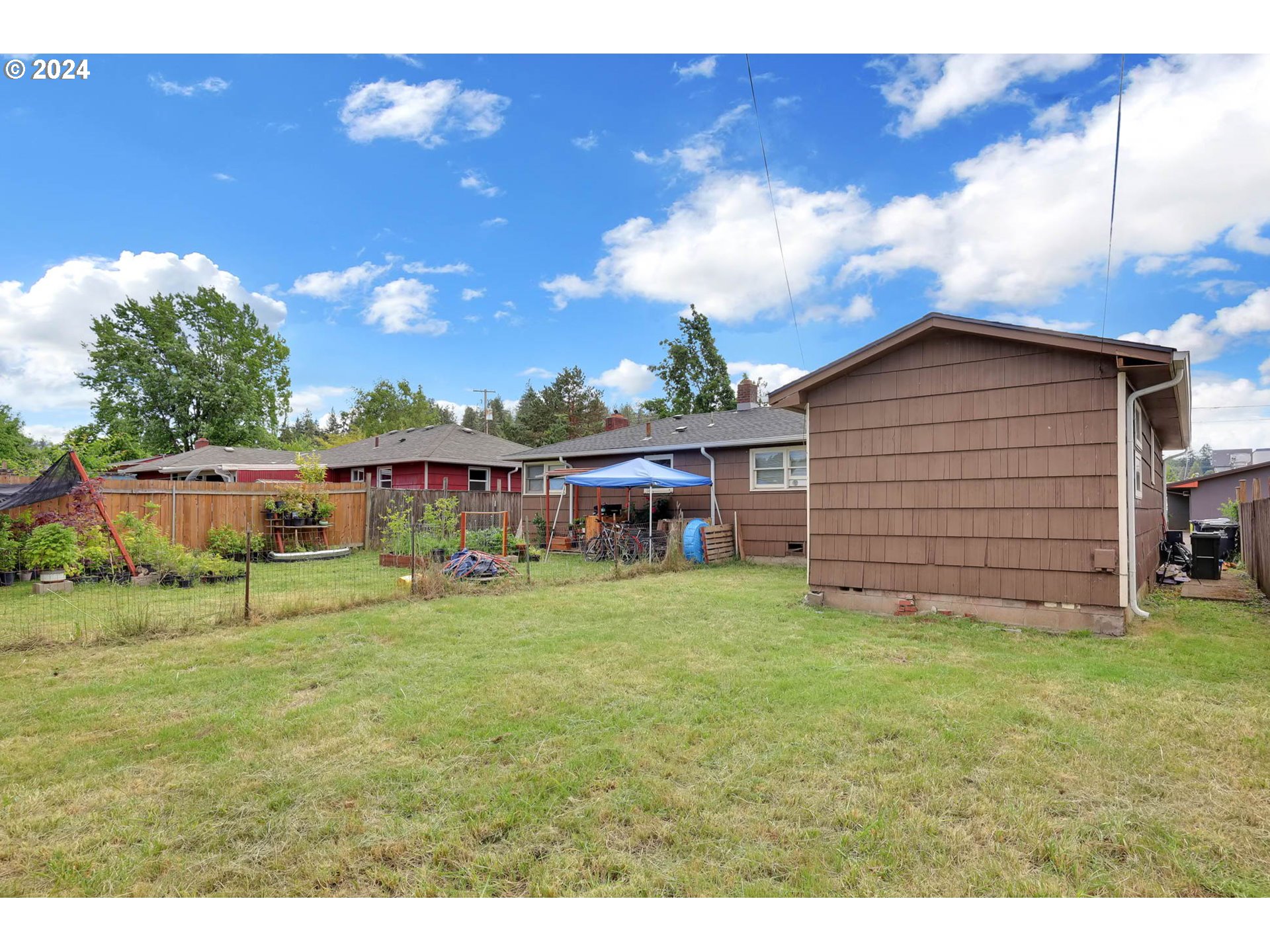2915-2925 Oak Street Eugene, OR 97405 - Photo 20 of 42 a view of a house with a yard