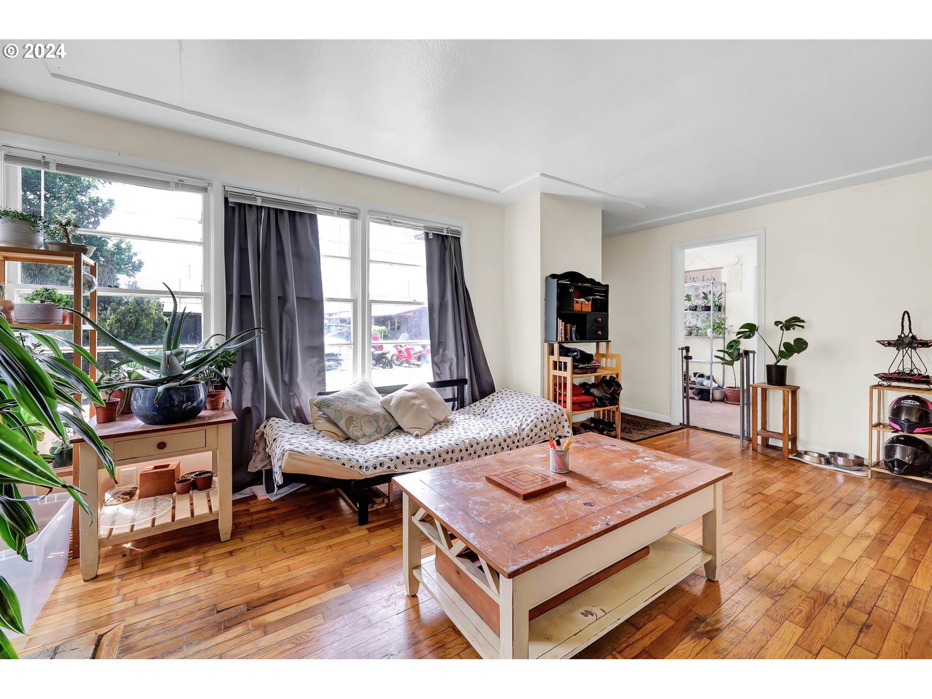 2915-2925 Oak Street Eugene, OR 97405 - Photo 23 of 42 a living room with furniture and a wooden floor