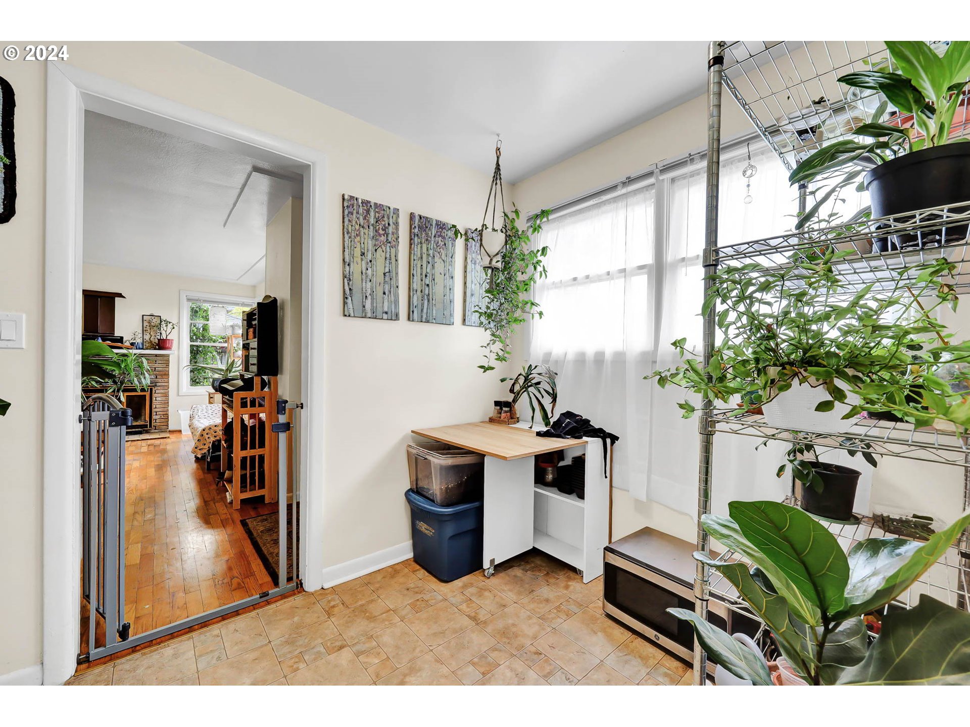 2915-2925 Oak Street Eugene, OR 97405 - Photo 26 of 42 a living room with furniture a window and a potted plant
