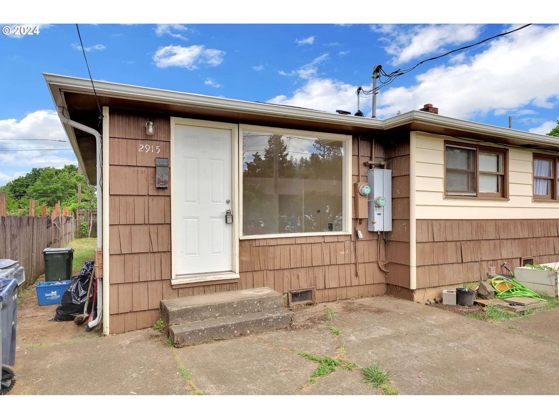 2915-2925 Oak Street Eugene, OR 97405 - Photo 3 of 42 a front view of a house with a garage