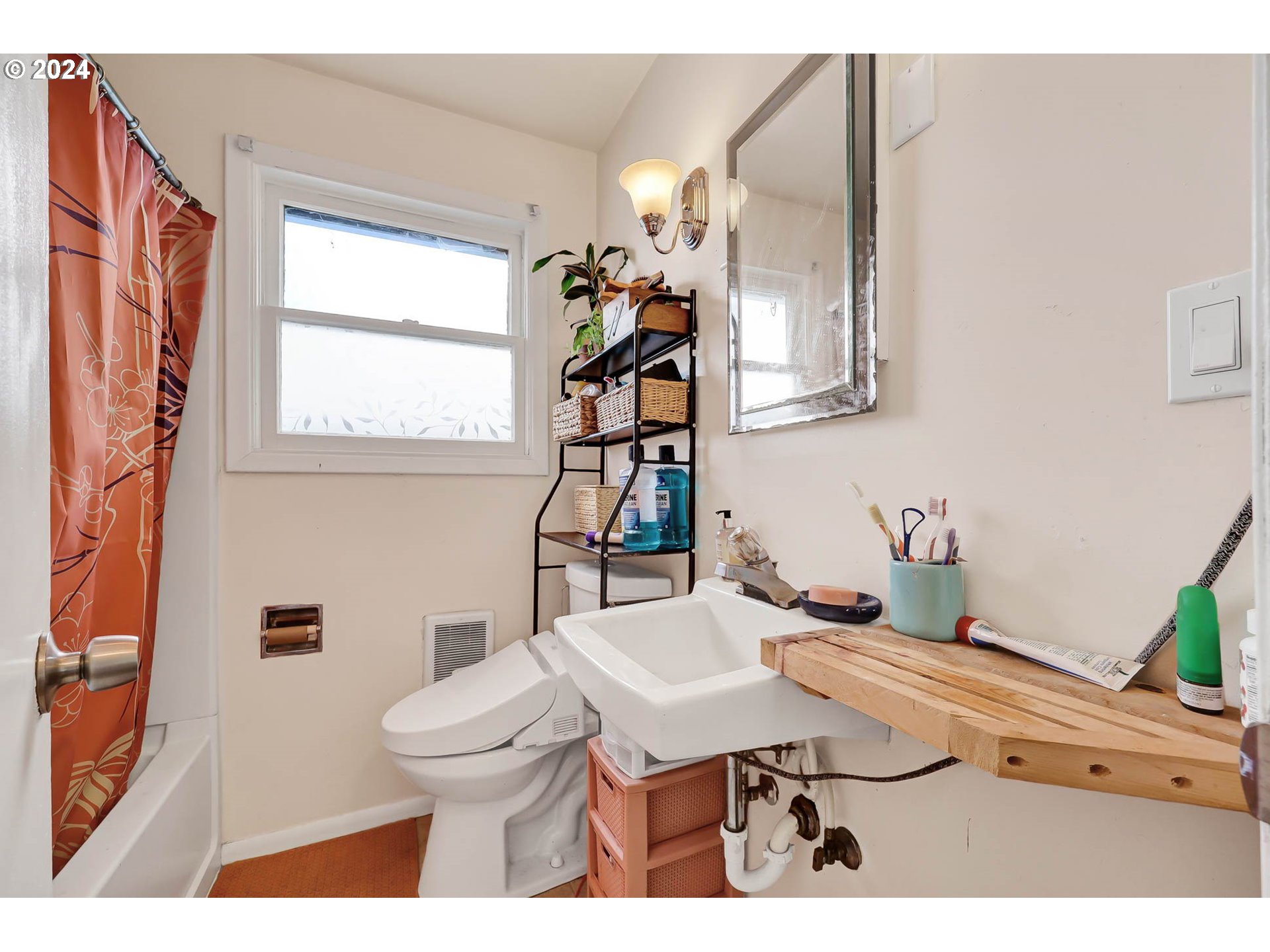 2915-2925 Oak Street Eugene, OR 97405 - Photo 37 of 42 a bathroom with a sink a toilet and mirror