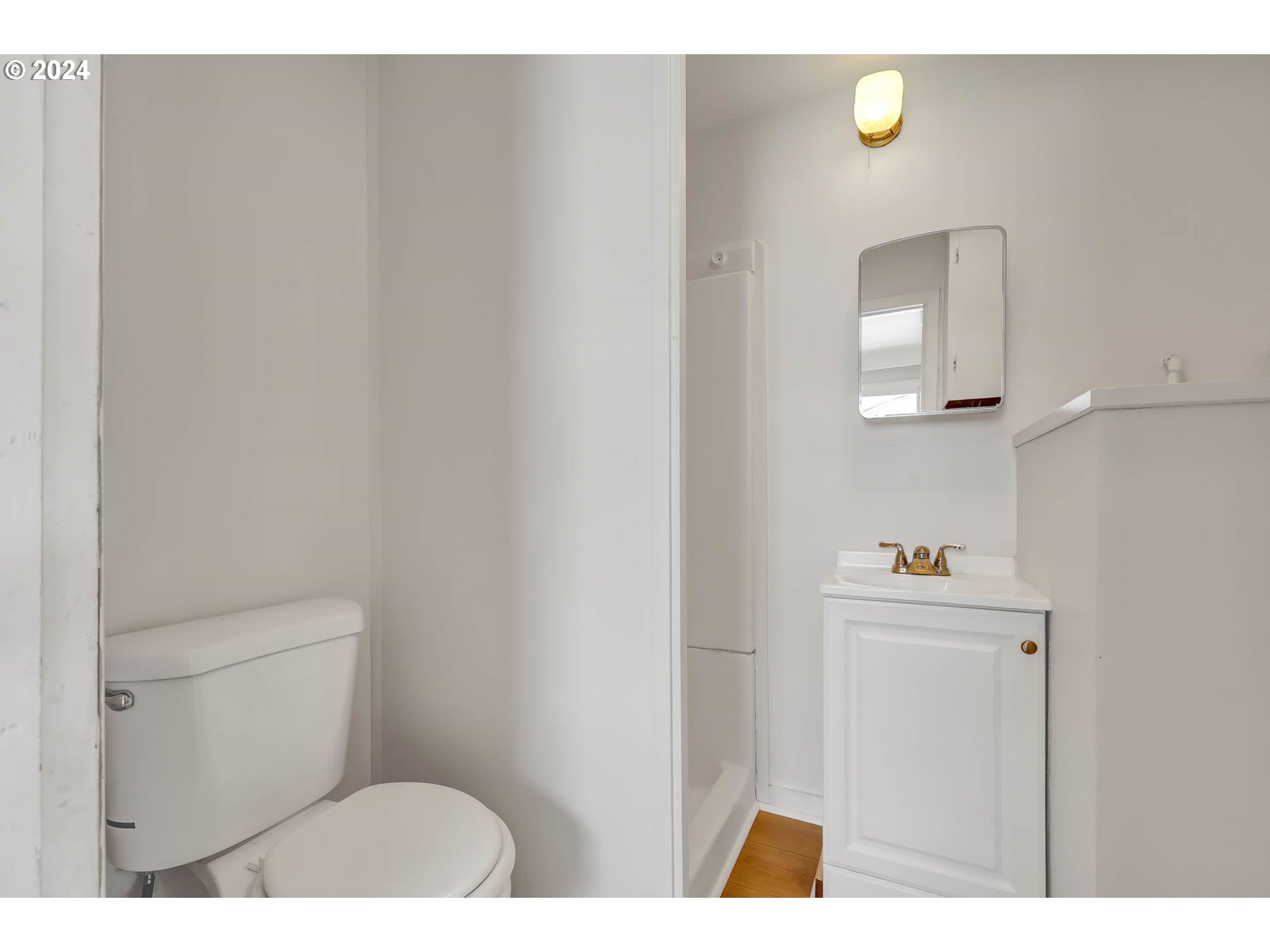 2915-2925 Oak Street Eugene, OR 97405 - Photo 9 of 42 a bathroom with a toilet and a sink