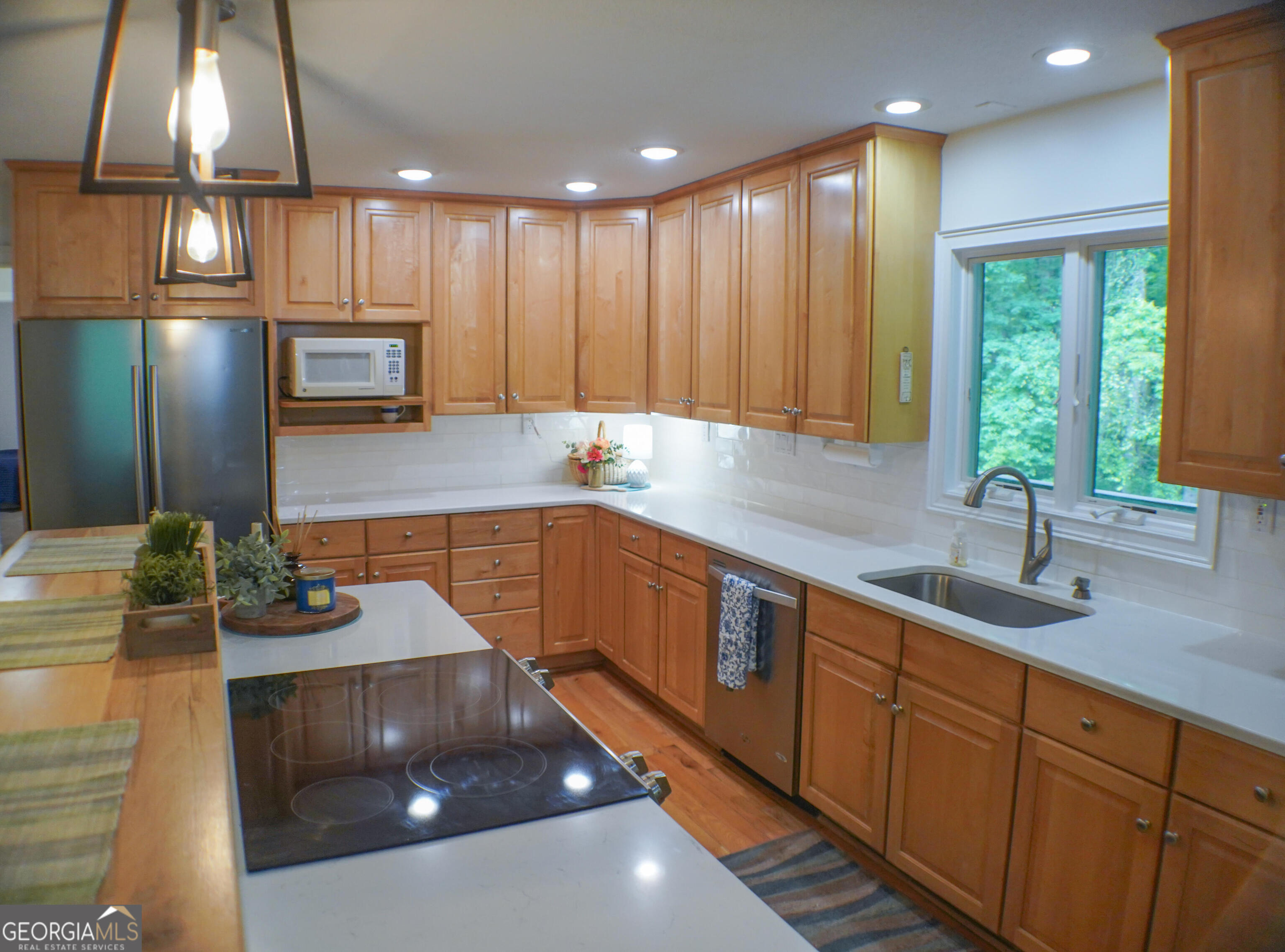 335 Winding Stream Trail Hampton, GA 30228 - Photo 10 of 35 a kitchen with a sink cabinets and window