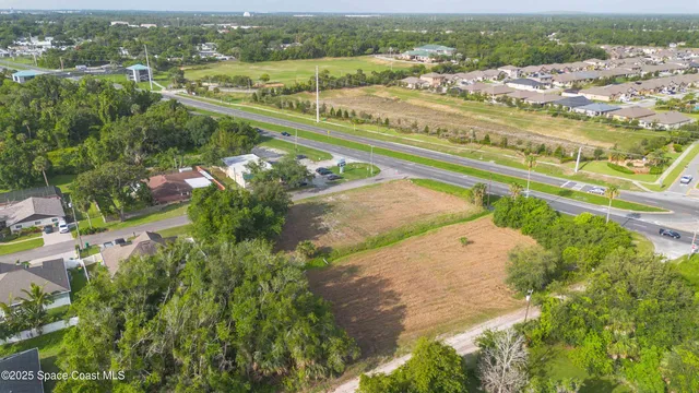 an aerial view of a city with lots of residential buildings