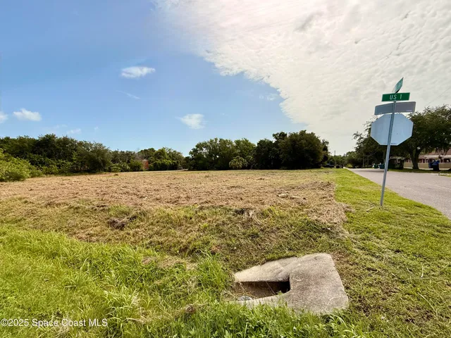a view of a lake with houses in the back