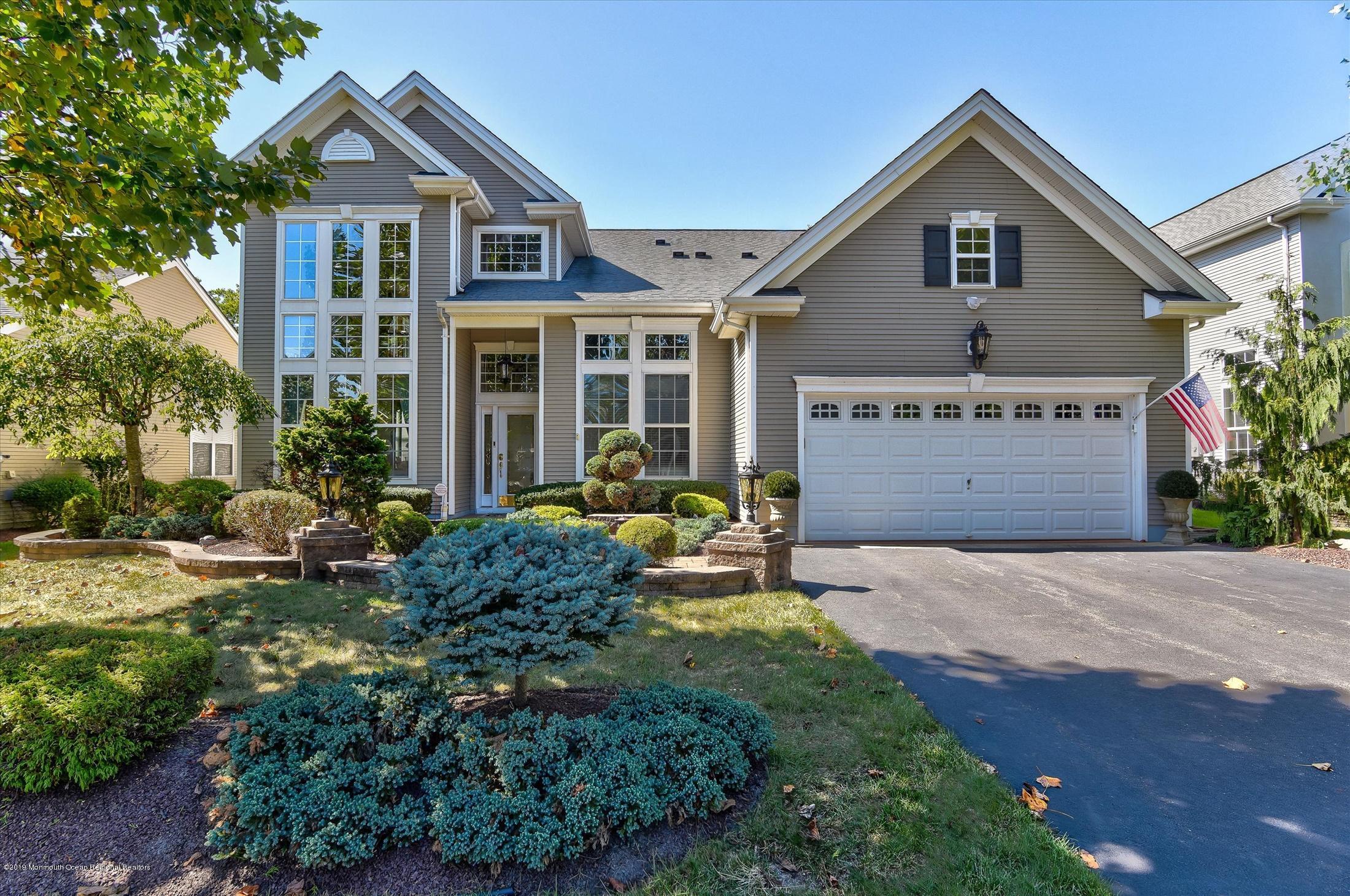 47 Portchester Drive Jackson, NJ 08527 - Photo 1 of 46 a front view of a house with garden