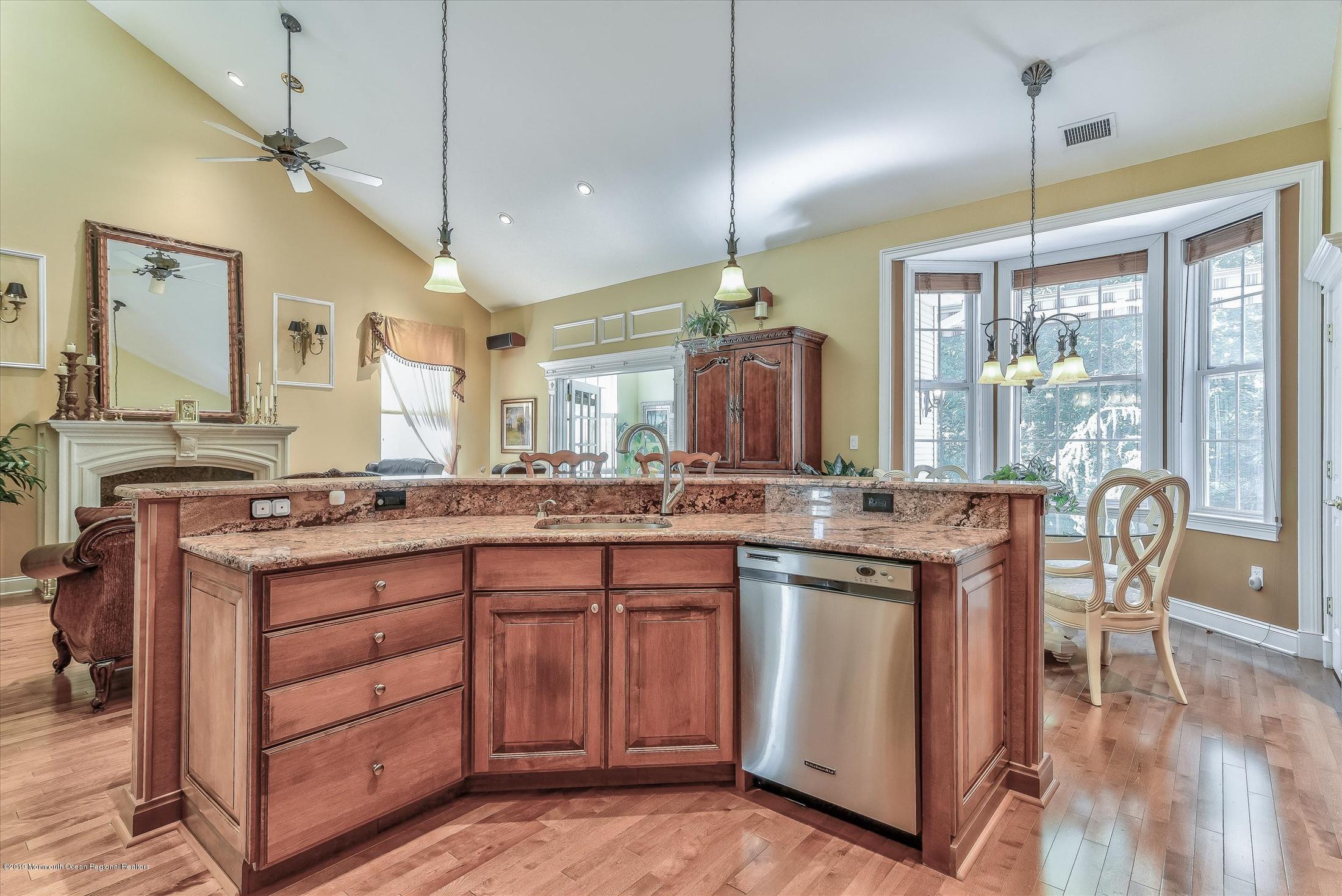 47 Portchester Drive Jackson, NJ 08527 - Photo 15 of 46 a kitchen with a sink stove and cabinets