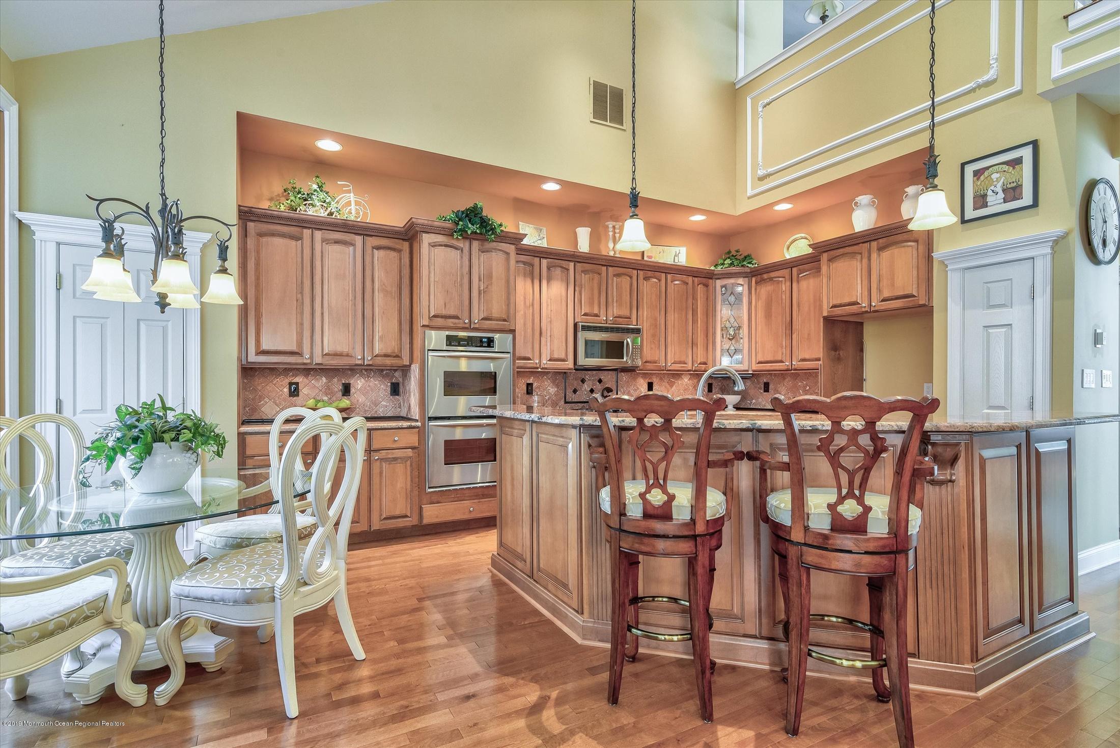 47 Portchester Drive Jackson, NJ 08527 - Photo 16 of 46 a dinning area with stainless steel appliances lots of wooden furniture