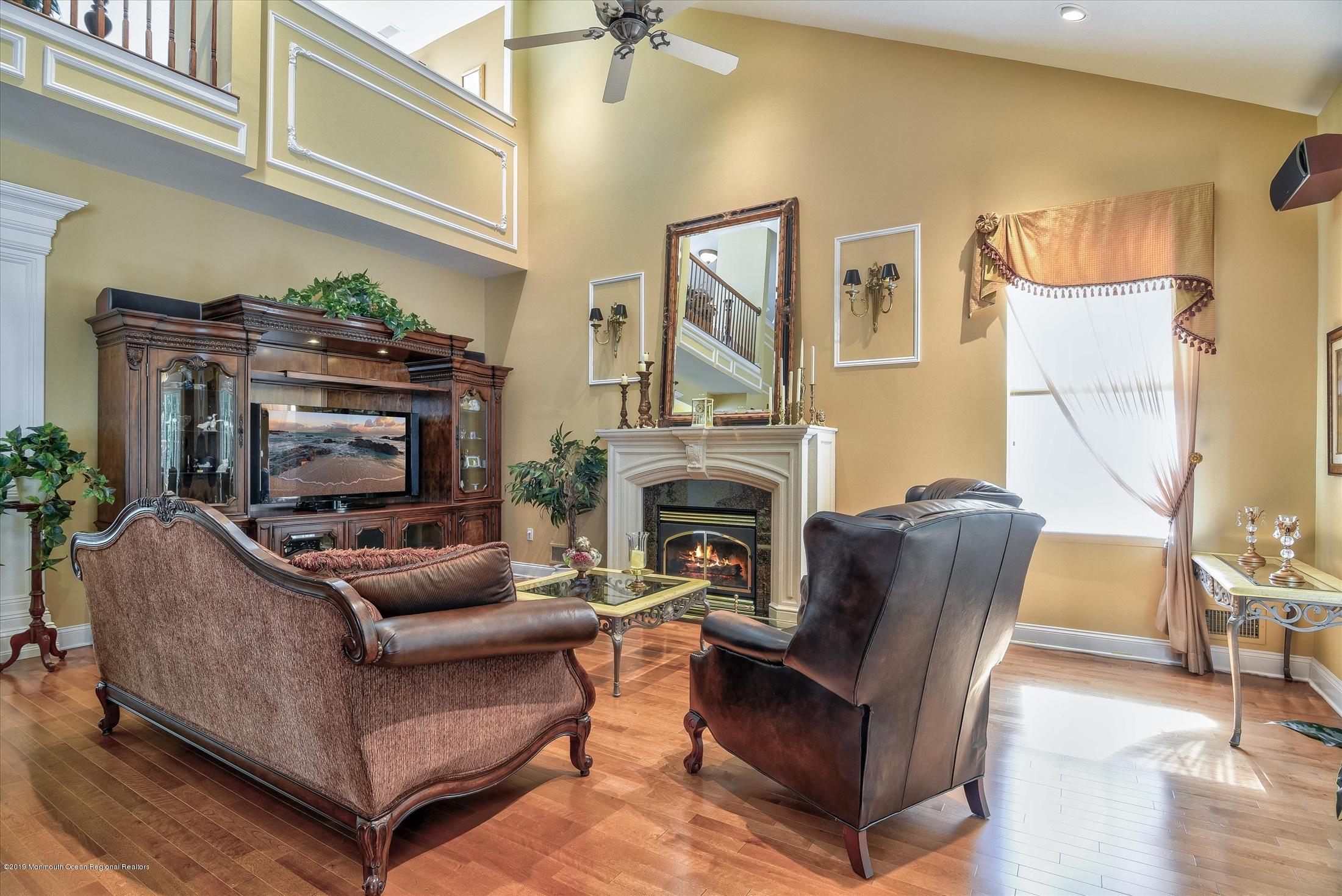 47 Portchester Drive Jackson, NJ 08527 - Photo 18 of 46 a living room with furniture and a fireplace