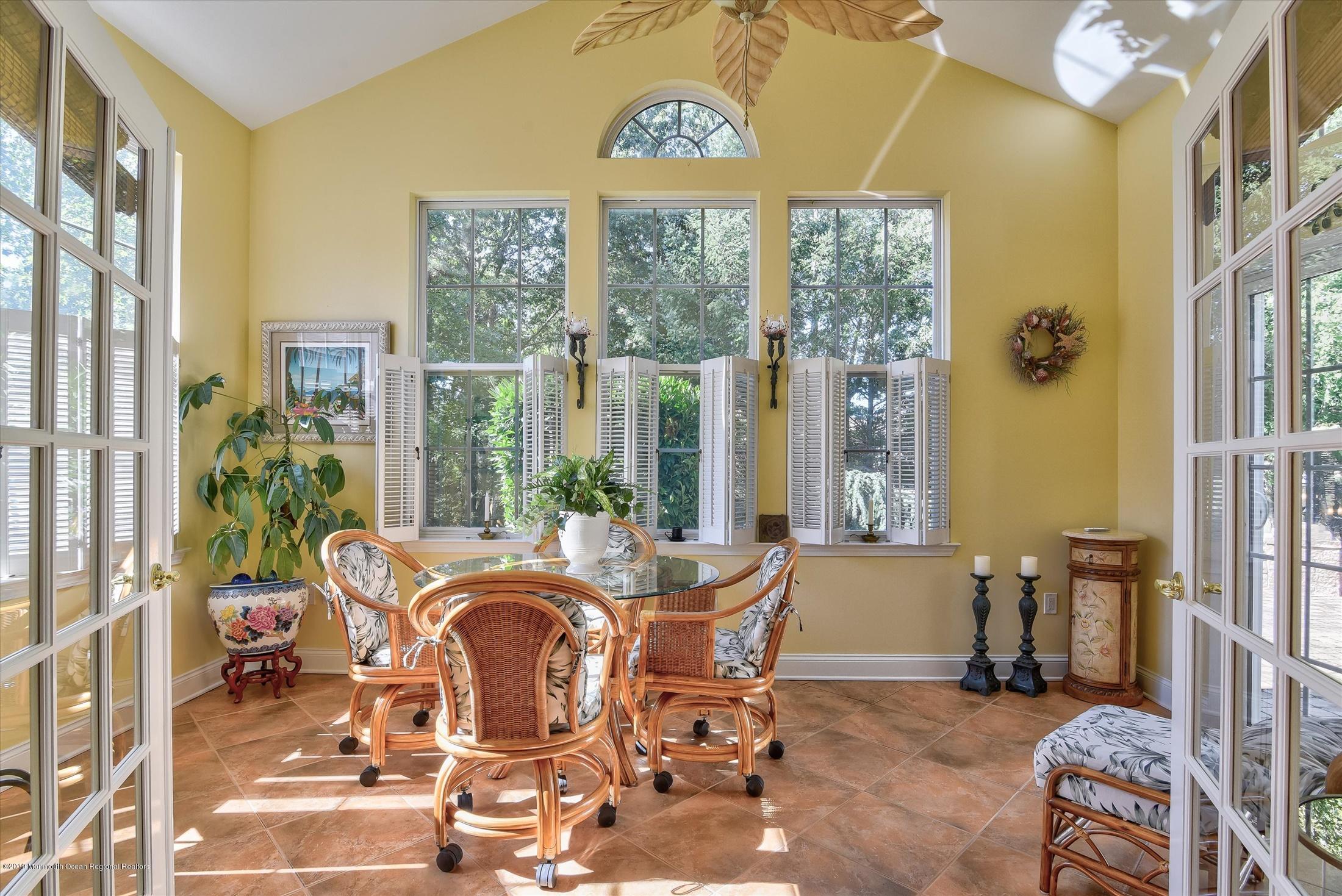 47 Portchester Drive Jackson, NJ 08527 - Photo 19 of 46 a view of a dining room with furniture large windows and wooden floor