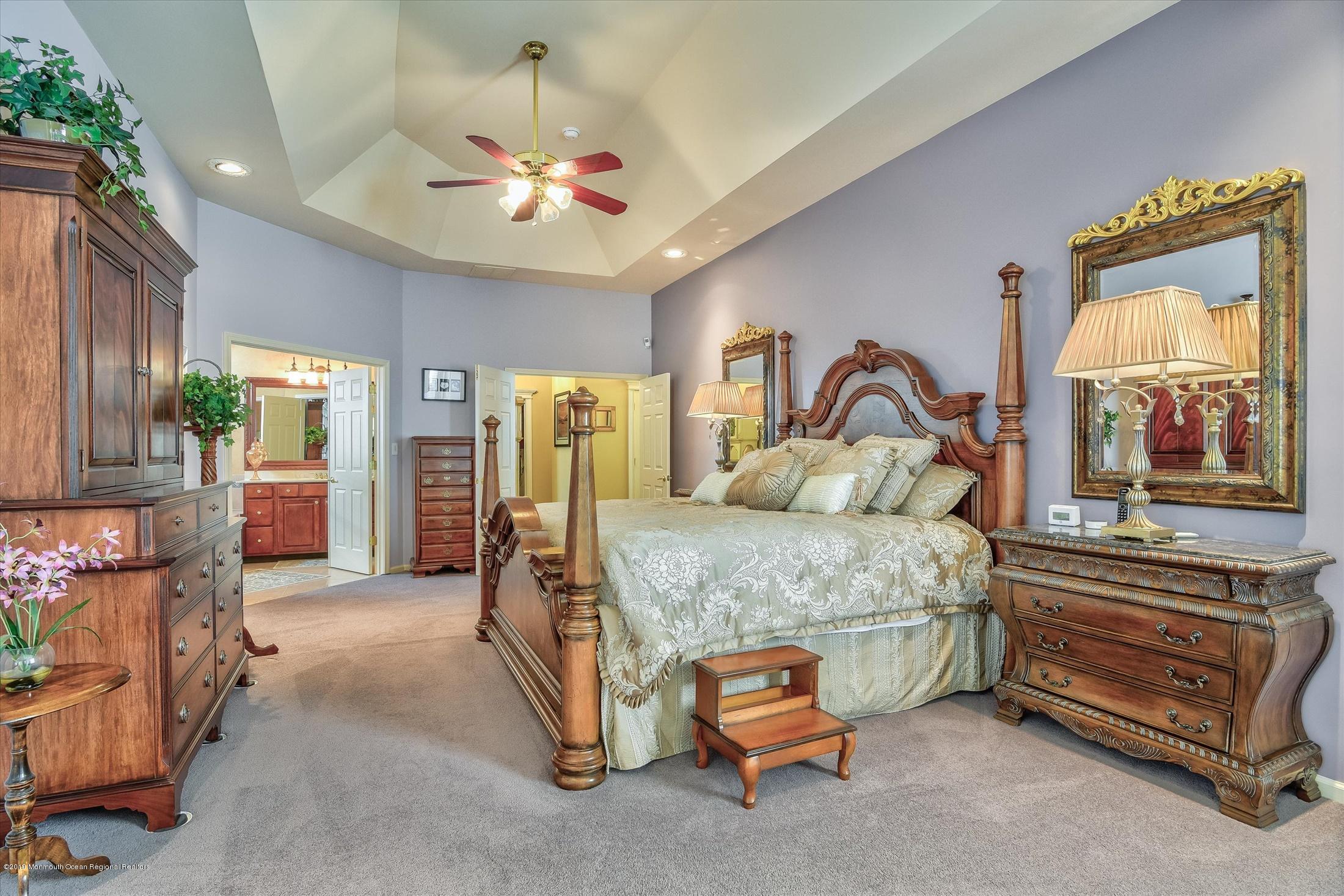 47 Portchester Drive Jackson, NJ 08527 - Photo 22 of 46 a bedroom with a bed couch and window