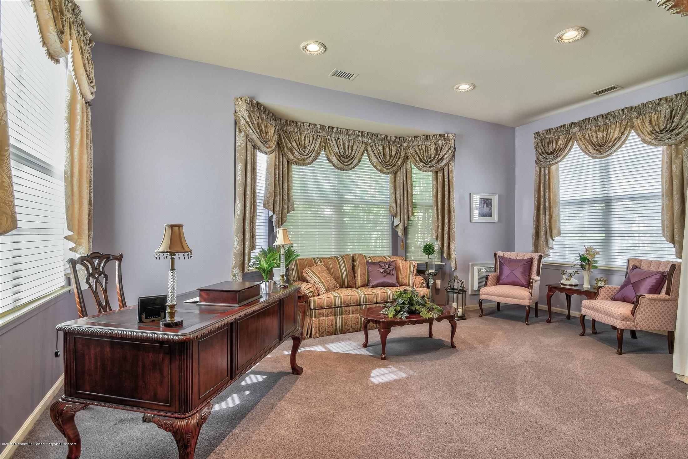 47 Portchester Drive Jackson, NJ 08527 - Photo 23 of 46 a living room with furniture and a large window