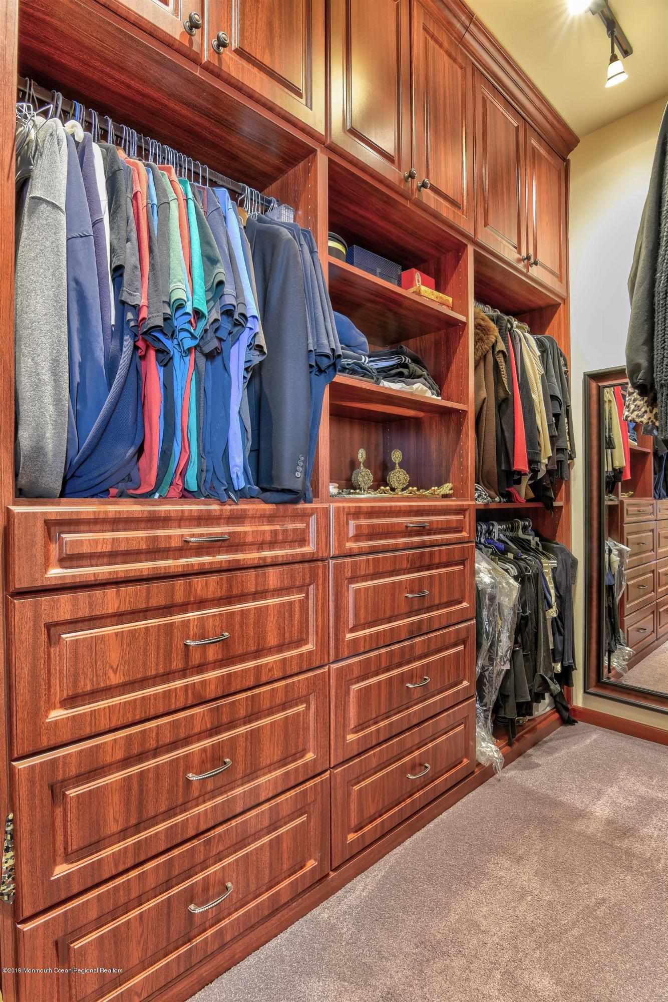 47 Portchester Drive Jackson, NJ 08527 - Photo 24 of 46 a view of walk in closet with clothes and shoes