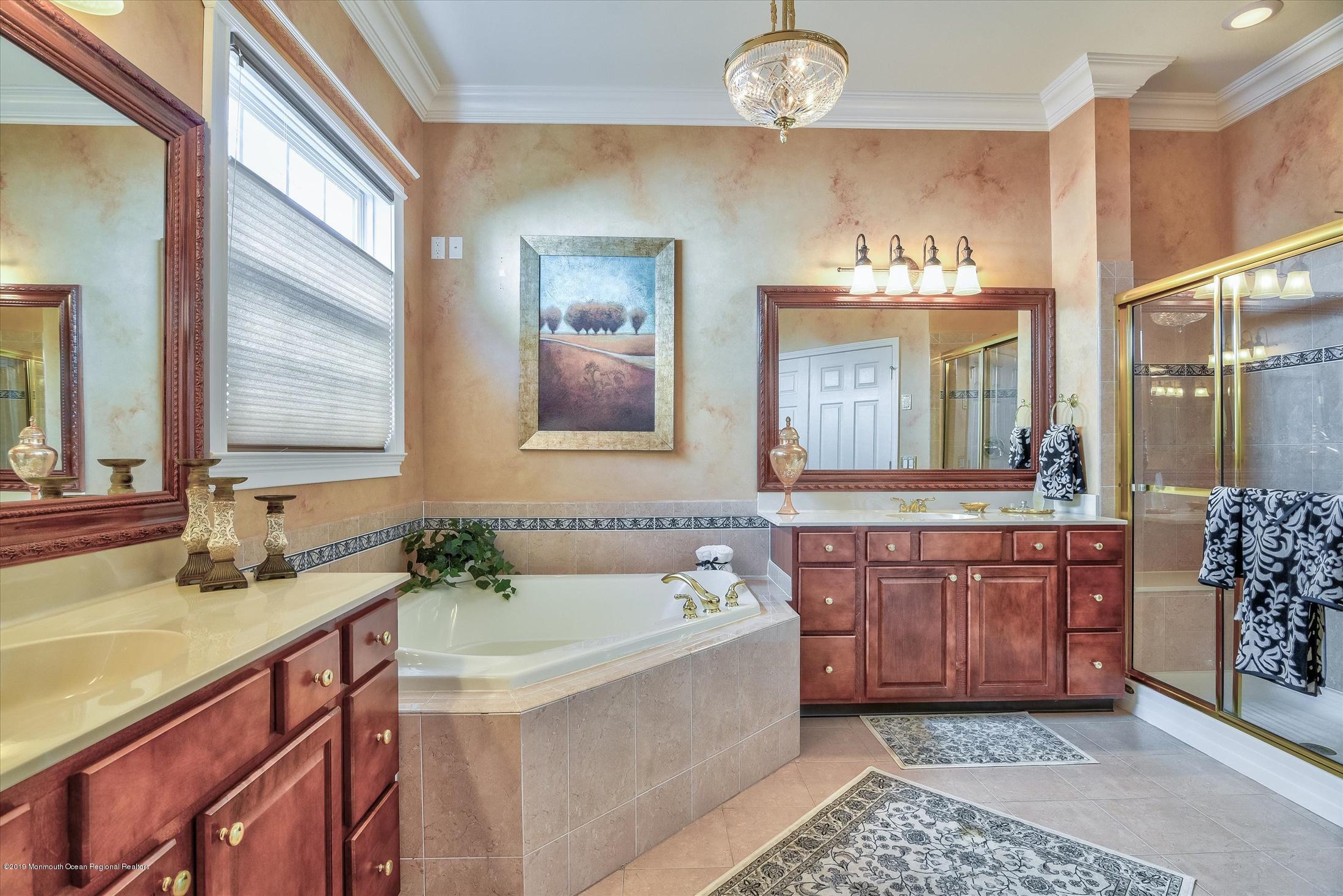 47 Portchester Drive Jackson, NJ 08527 - Photo 25 of 46 a spacious bathroom with a tub sink and mirror