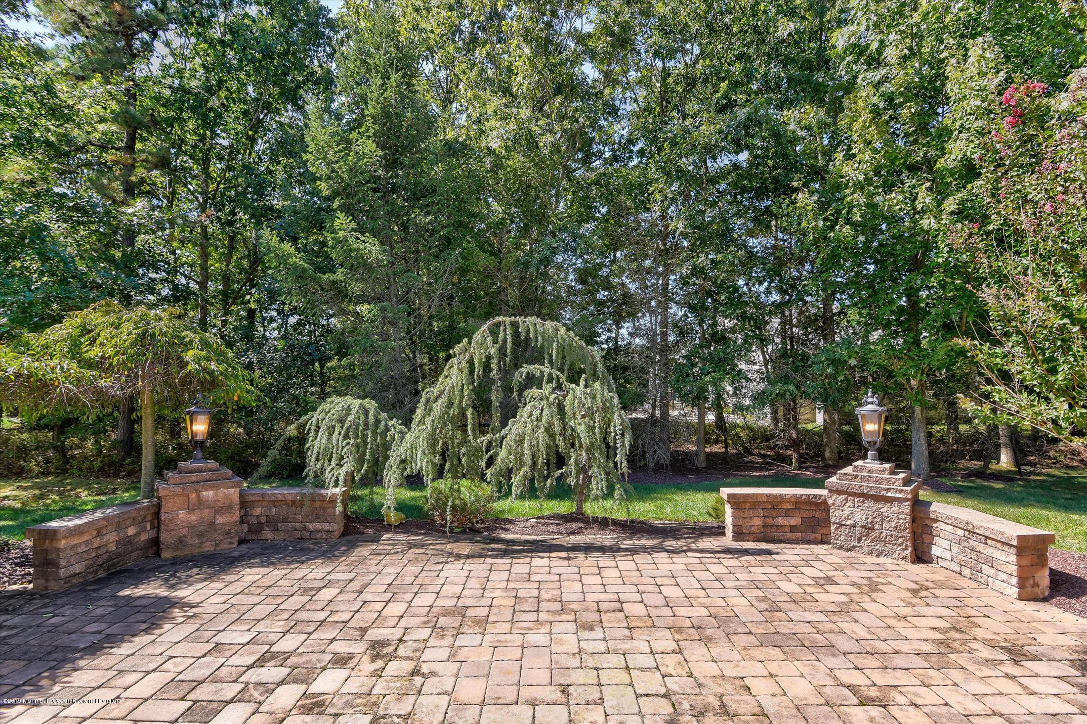 47 Portchester Drive Jackson, NJ 08527 - Photo 35 of 46 a view of a chairs and tables in the back yard of the house