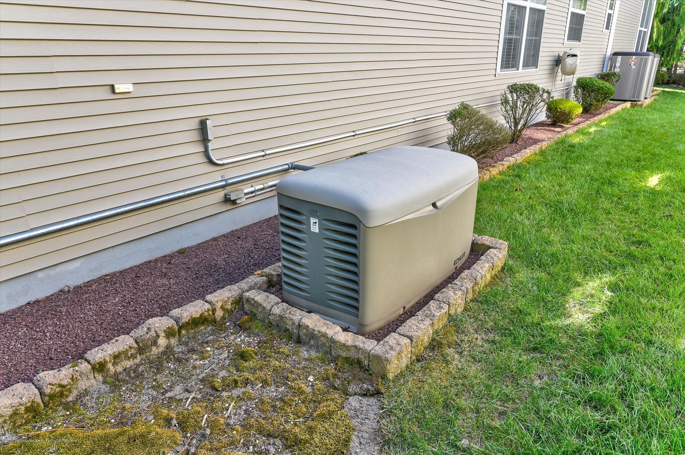 47 Portchester Drive Jackson, NJ 08527 - Photo 37 of 46 a pathway of a house with a yard