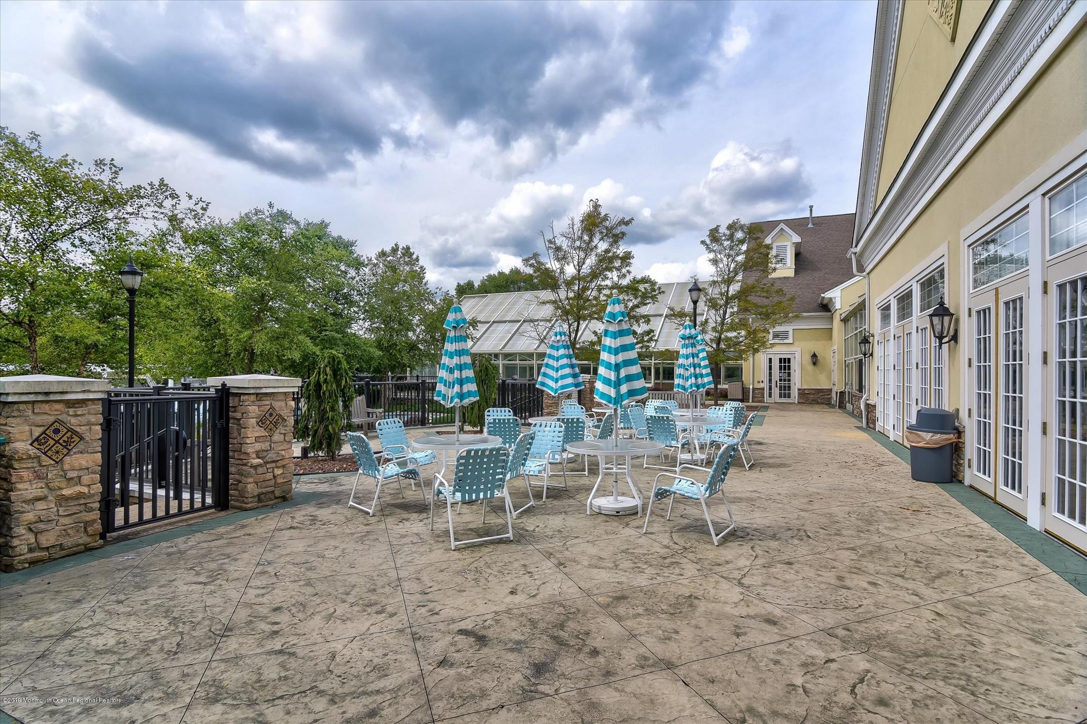 47 Portchester Drive Jackson, NJ 08527 - Photo 40 of 46 a view of a patio with a table and chairs