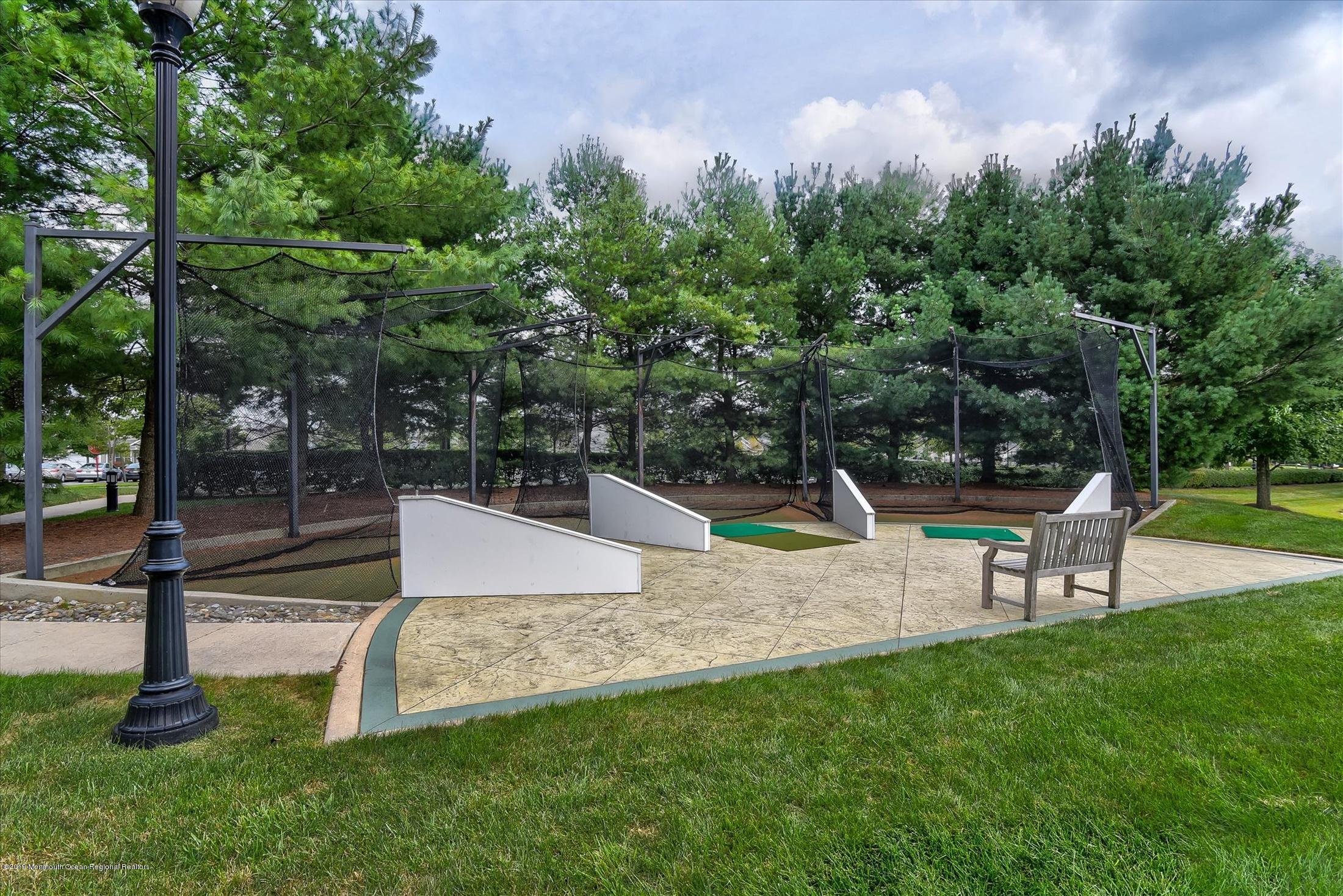 47 Portchester Drive Jackson, NJ 08527 - Photo 42 of 46 a view of a park with swings