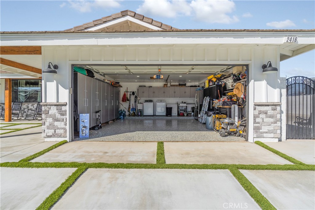 2416 Hialeah Circle Norco, CA 92860 - Photo 40 of 71 2416 Hialeah Circle Garage with Epoxy floors and cabinets
