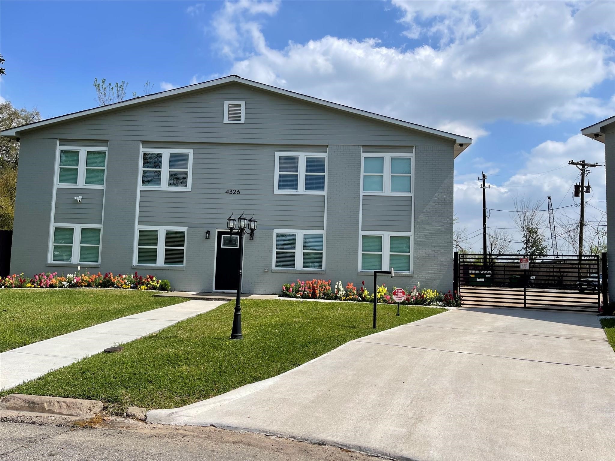 4326 Alconbury Lane, Unit 6 Houston, TX 77021 - Photo 1 of 28 a front view of a house with a yard