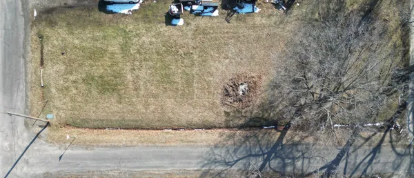 a view of a backyard of the house