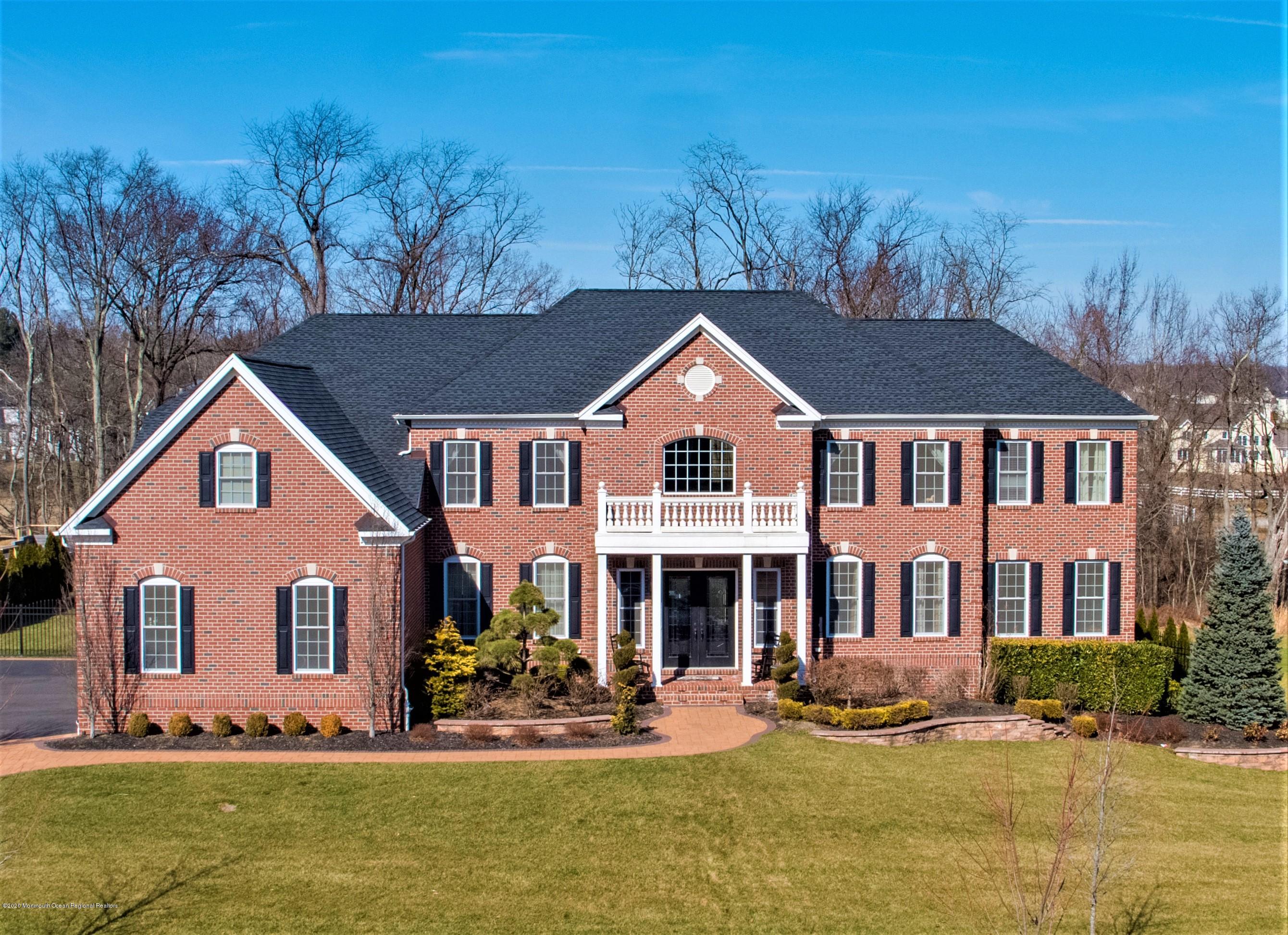 a front view of a house with a yard table and chairs