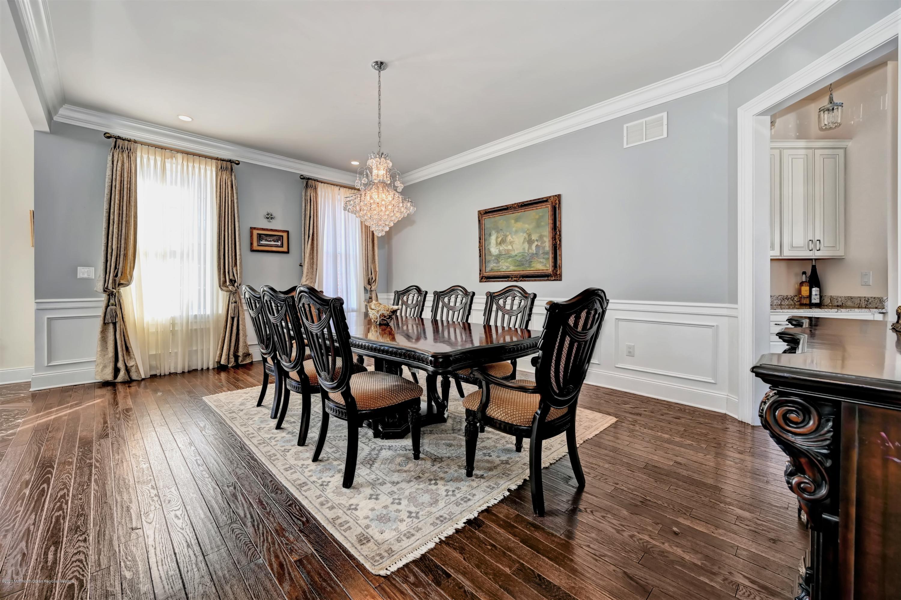 15 Windermere Road Lincroft, NJ 07738 - Photo 14 of 56 a view of a a dining room with furniture window and wooden floor