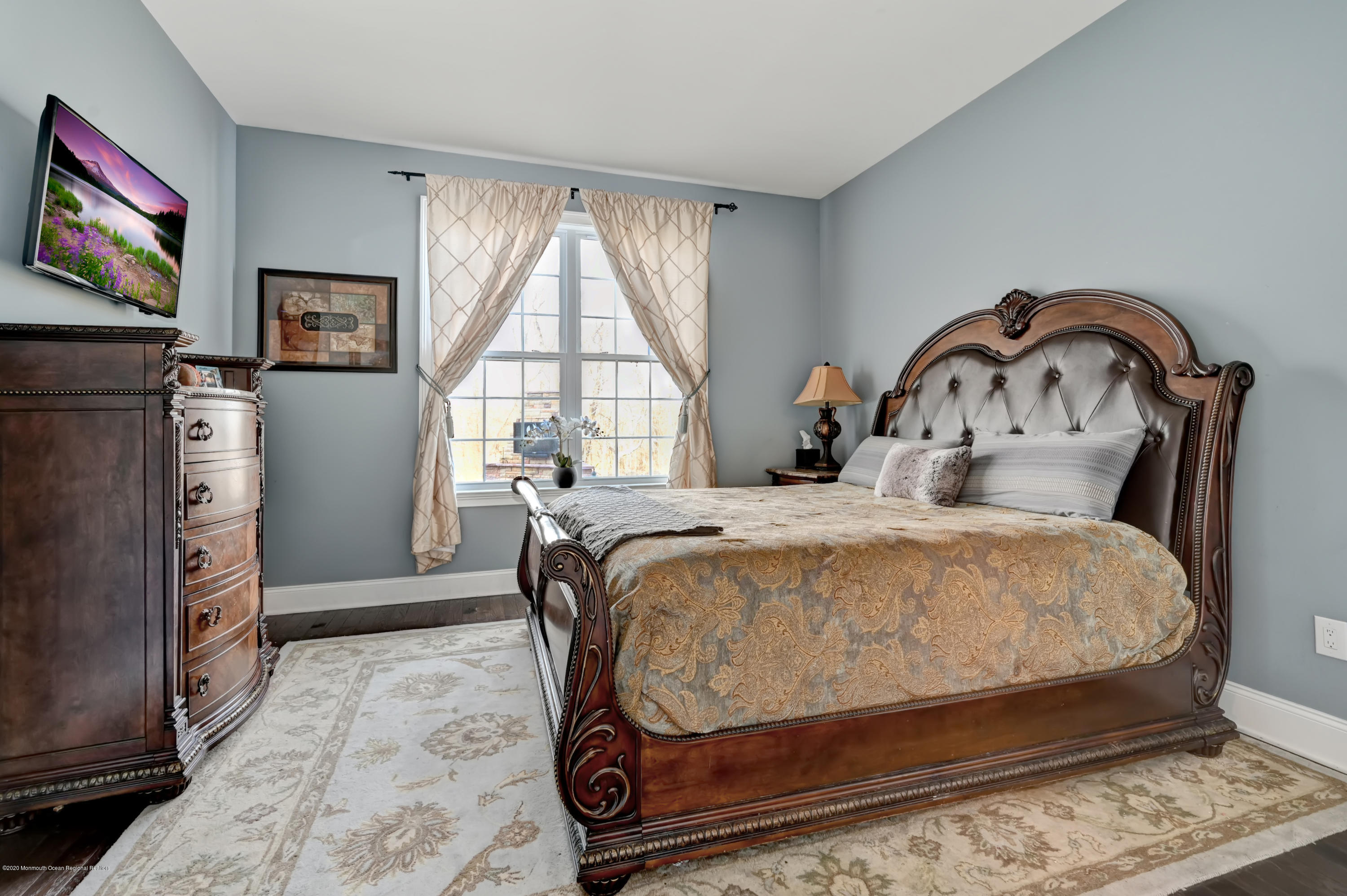 15 Windermere Road Lincroft, NJ 07738 - Photo 22 of 56 a bed sitting in a bedroom next to a window