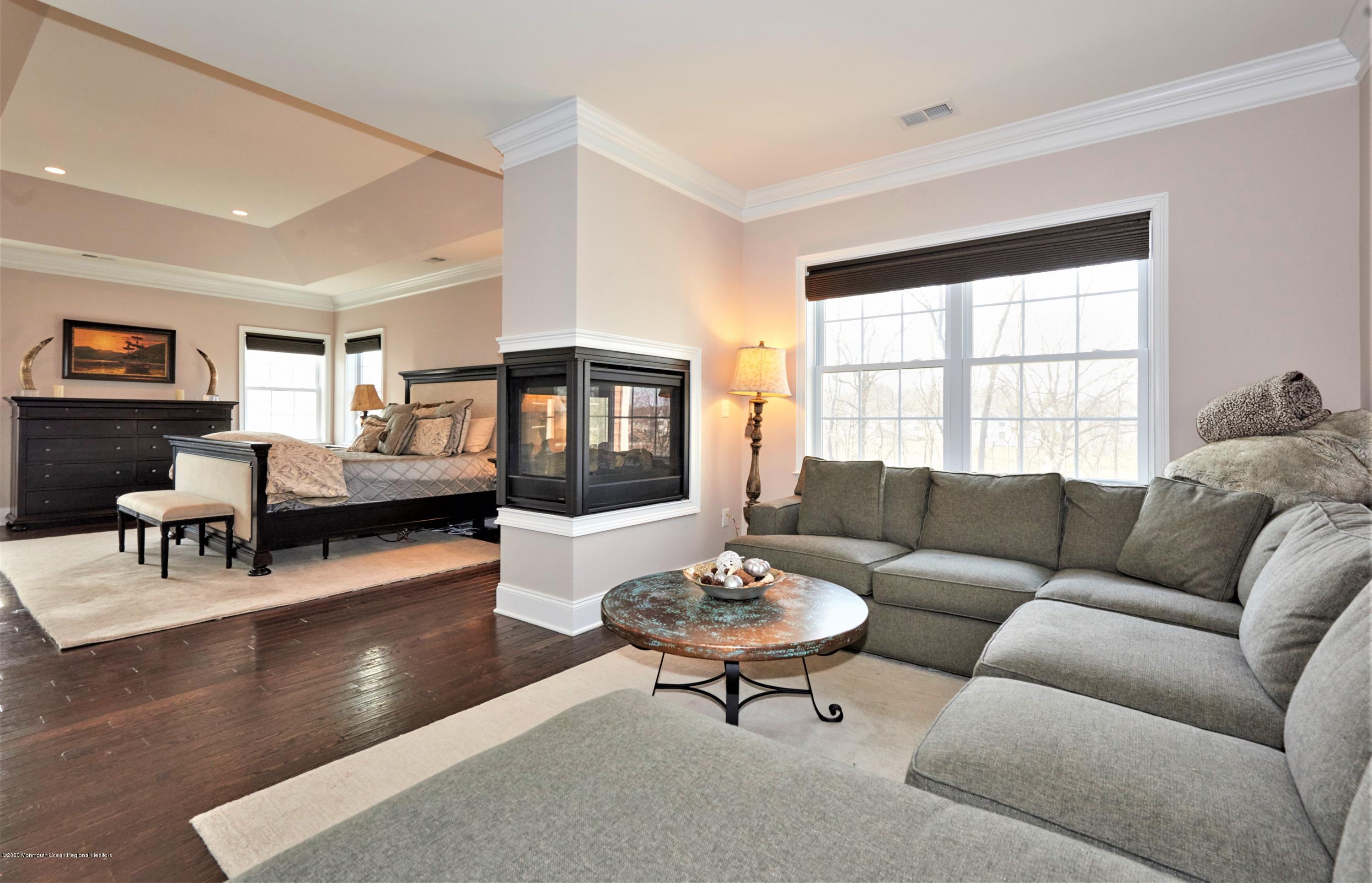 15 Windermere Road Lincroft, NJ 07738 - Photo 27 of 56 a living room with furniture and a large window