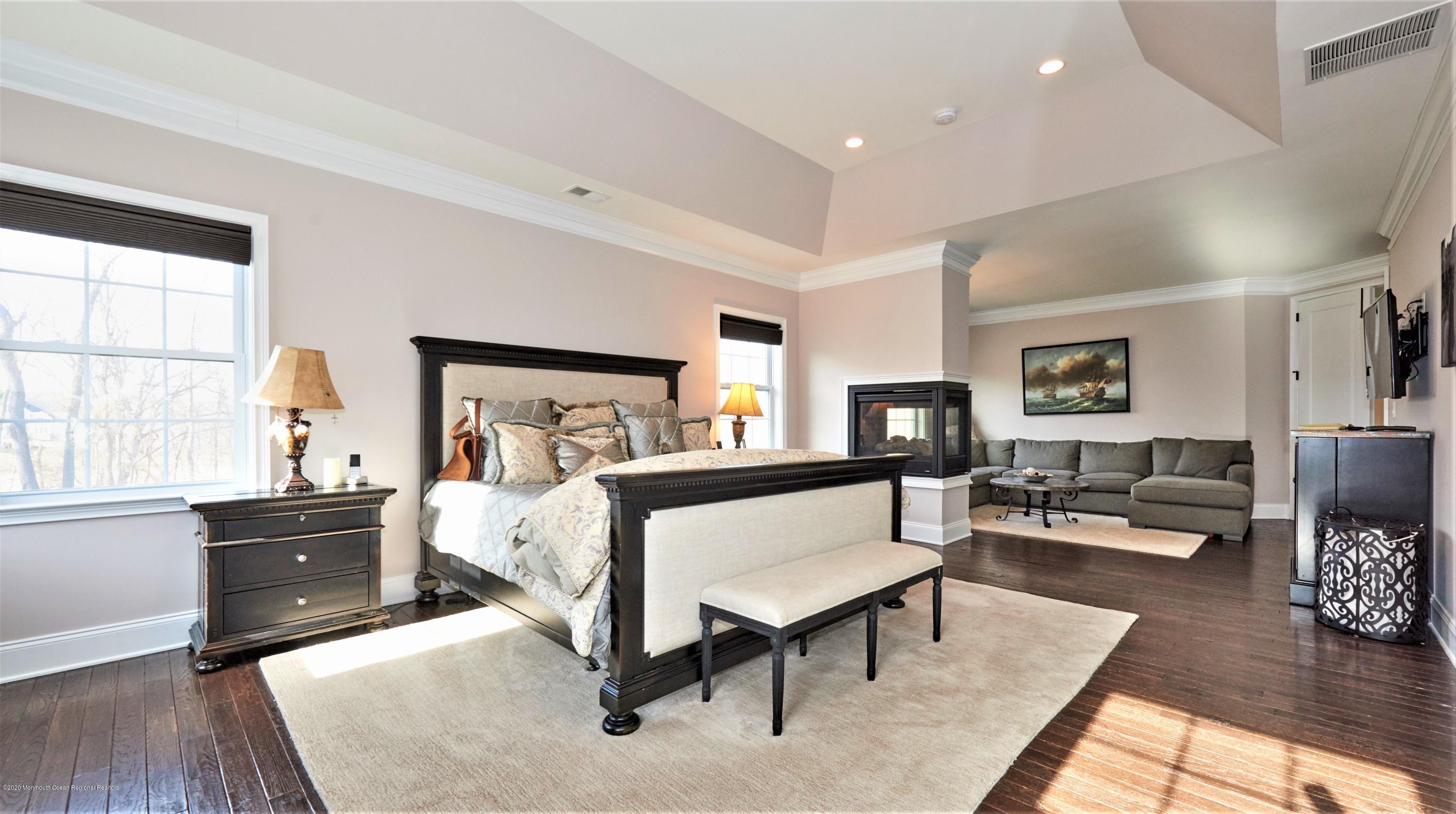 15 Windermere Road Lincroft, NJ 07738 - Photo 29 of 56 a bed room with furniture and a wooden floor