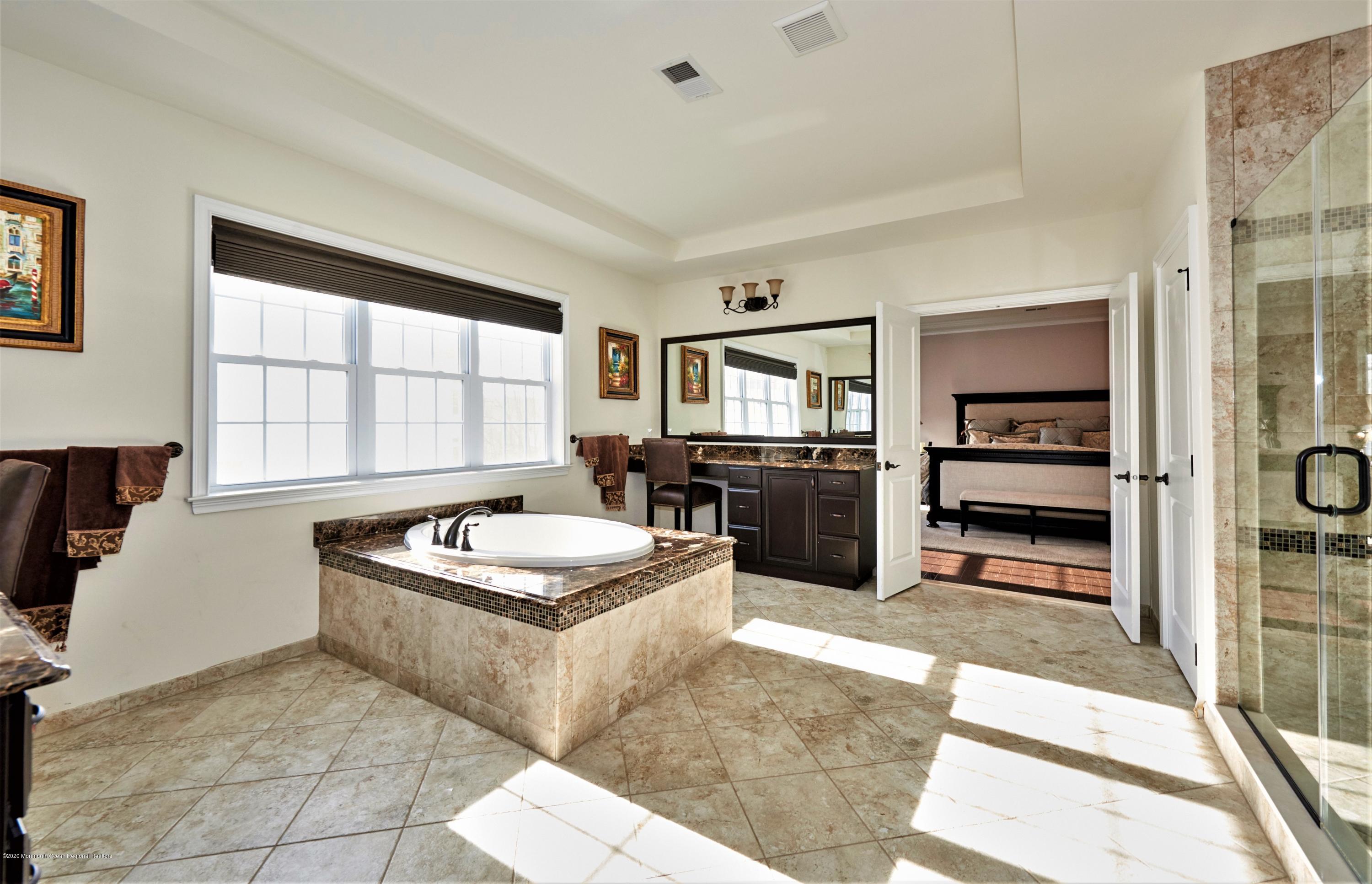 15 Windermere Road Lincroft, NJ 07738 - Photo 30 of 56 a large kitchen with a stove a sink and a refrigerator
