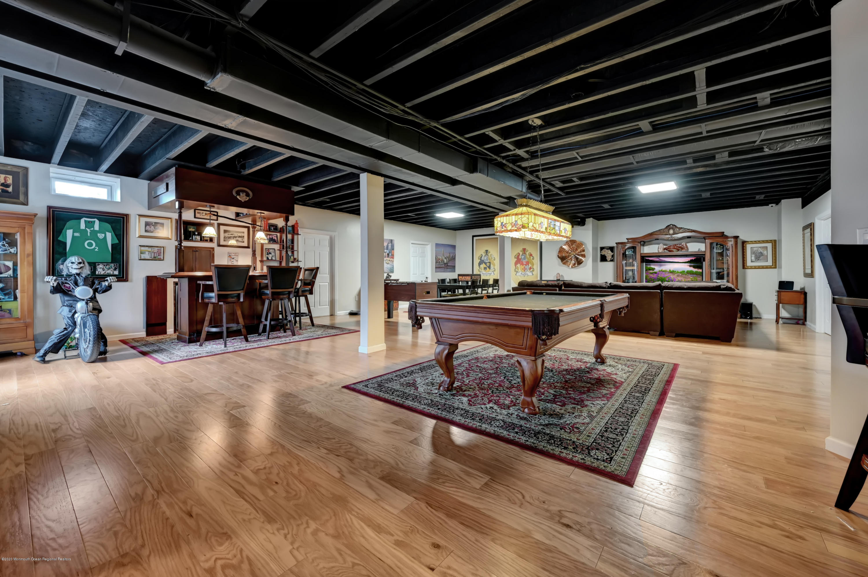 15 Windermere Road Lincroft, NJ 07738 - Photo 32 of 56 a living room with lots of furniture and a rug