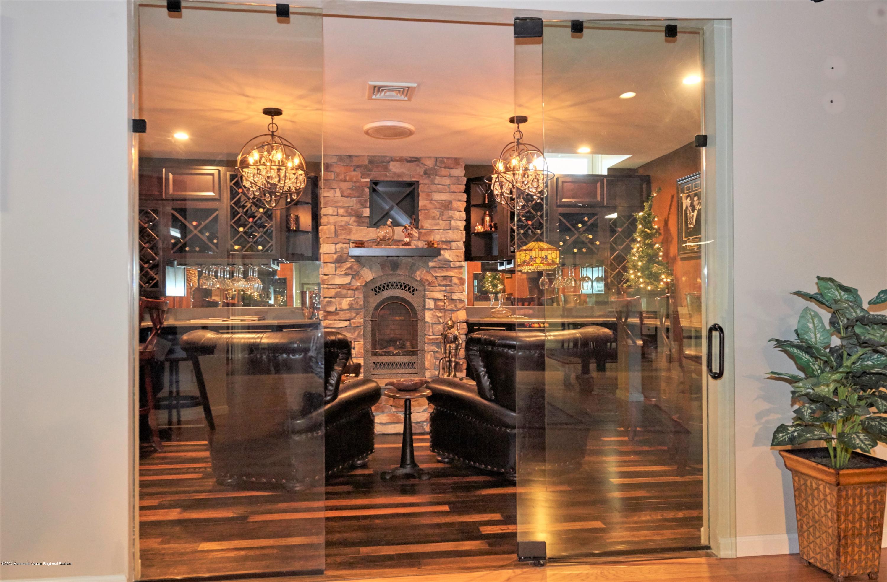 15 Windermere Road Lincroft, NJ 07738 - Photo 36 of 56 25-Wine-Cigar Rm glass enclosed