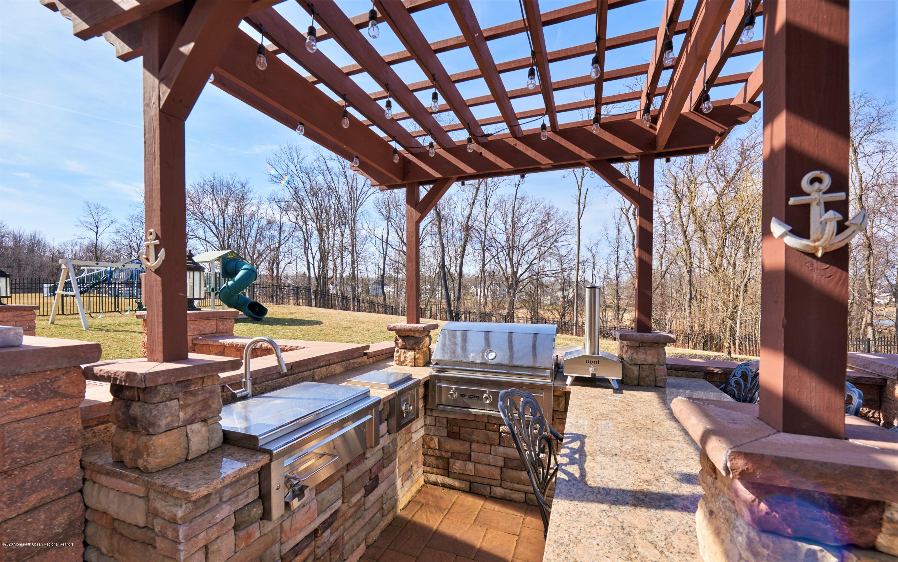 15 Windermere Road Lincroft, NJ 07738 - Photo 48 of 56 a outdoor space with patio lots of furniture